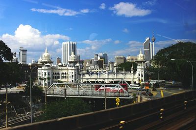View of buildings against cloudy sky