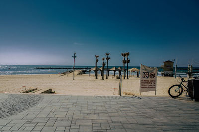 Scenic view of beach against blue sky