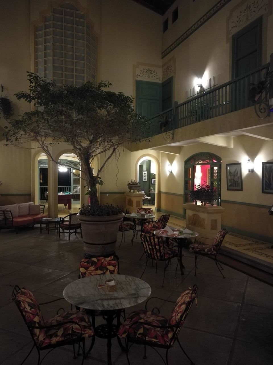 VIEW OF ILLUMINATED RESTAURANT BY BUILDING