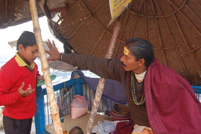 Men working in traditional clothing