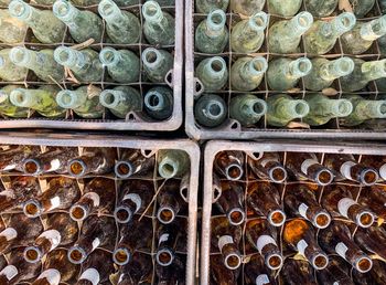 Full frame shot of bottles in trays