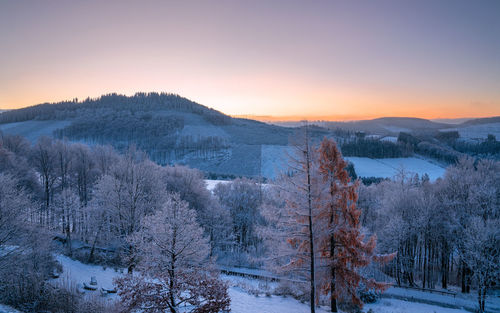 Scenic view of mountains against sky during sunset