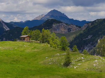 Scenic view of landscape and mountains against sky