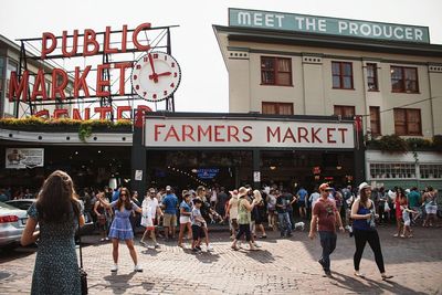People in city against sky