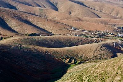 High angle view of road passing through field