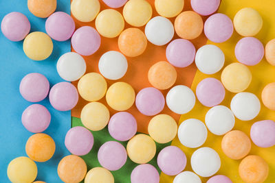 Candy on the colorful background, high angle view, circle candies