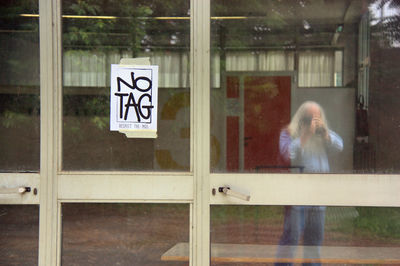 Woman with text on window