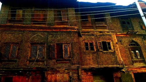 Low angle view of old building against sky at night