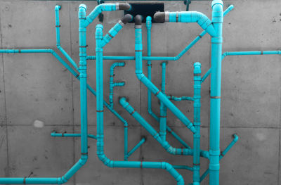 Blue pipes on wall