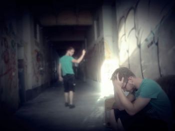 Full length of woman standing on escalator