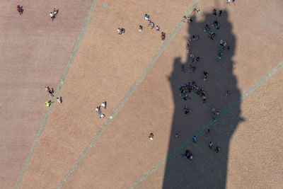 High angle view of people on town square in city during sunny day