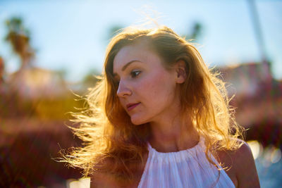 Close up young woman standing outdoors