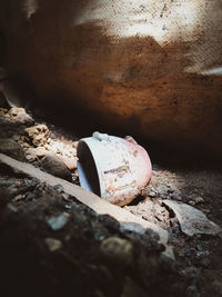 Close-up of abandoned bottle