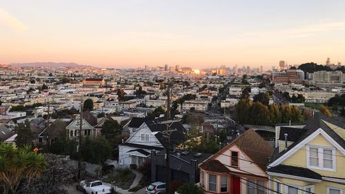 High angle view of city at sunset