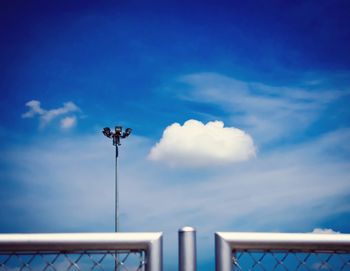 Low angle view of floodlight against sky