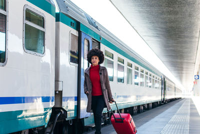 Elegant woman going for business trip on train