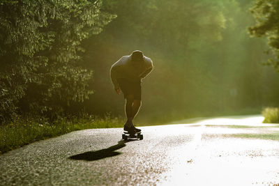 Man skating on road