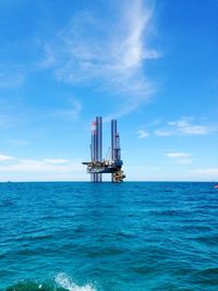 Offshore platform over sea against sky