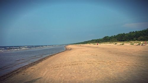 Scenic view of beach against clear sky