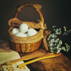 Close-up of eggs in basket on table