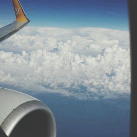 airplane, air vehicle, aircraft wing, flying, transportation, mode of transport, part of, sky, cropped, mid-air, aerial view, cloud - sky, travel, cloud, journey, aeroplane, public transportation, jet engine, landscape, nature