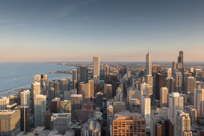 Aerial view of city buildings against sky