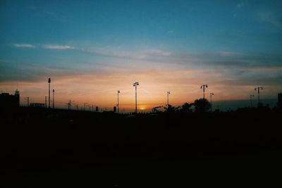 Silhouette landscape against sky during sunset