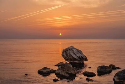 Scenic view of sea at sunset