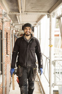 Portrait of happy male construction worker