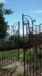 Metal gate against sky