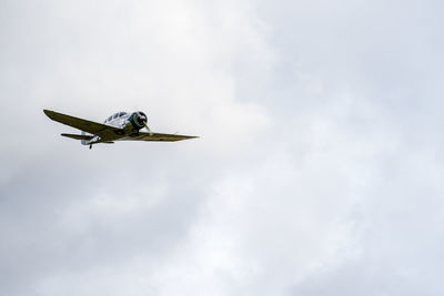 Low angle view of airplane flying in sky