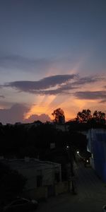 High angle view of buildings against sky during sunset