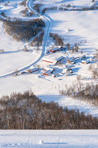 High angle view of snow covered road in city