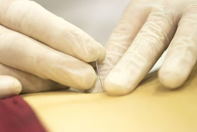 Close-up of doctor injecting patient