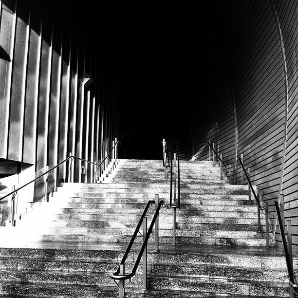 the way forward, indoors, built structure, architecture, steps, railing, staircase, empty, diminishing perspective, steps and staircases, absence, narrow, vanishing point, ceiling, tunnel, illuminated, wall - building feature, building, stairs, long