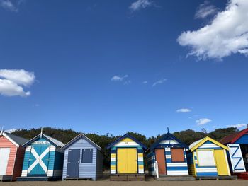 Beach huts against blue sky
