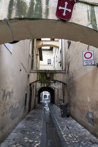 Empty alley amidst buildings