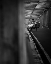 Man walking on railroad track