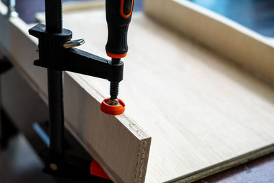 High angle view of wooden planks on table at workshop