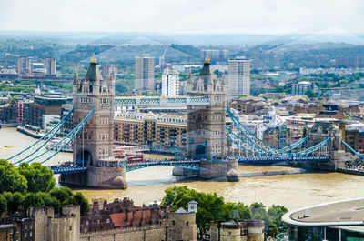 High angle view of bridge over river and buildings in city