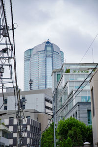 Low angle view of modern buildings against sky