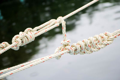 Close-up of rope tied on metal