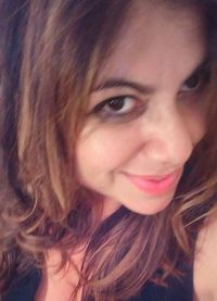 Close-up portrait of smiling young woman