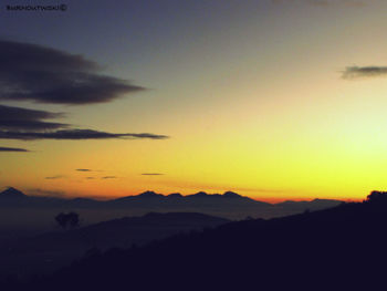 Scenic view of silhouette mountain against sky during sunset