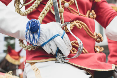 Rear view of man holding umbrella