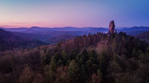 Scenic view of mountains against sky at sunset