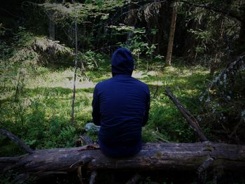 Woman standing in forest