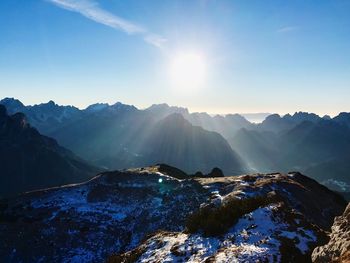 Scenic view of mountains against sky during winter