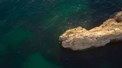 High angle view of rock on sea shore