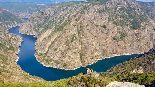 High angle view of lake amidst mountains